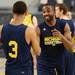 Michigan fifth-year senior Corey Person smiles as he and teammate sophomore Trey Burke take the court for practice at Cowboys Stadium in Arlington, Texas on Thursday, March 28, 2013. Melanie Maxwell I AnnArbor.com
